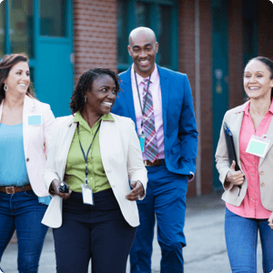 Teachers smiling and walking together