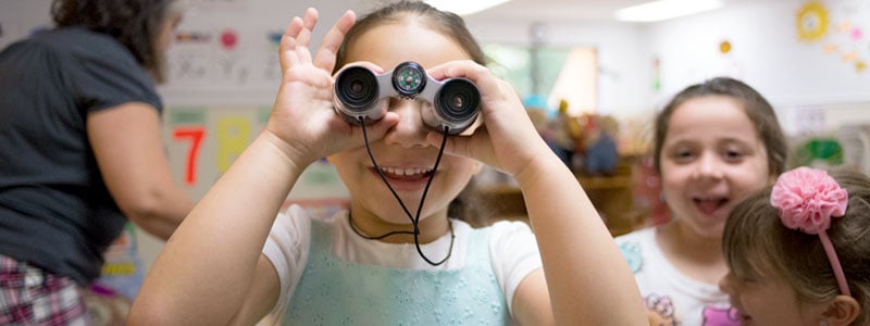 Girl with a CLASS lens binocular